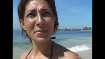 Tanned cougar was picked up on a public beach for kinky sex and a facial - sunporno.com - Germany - Brazil